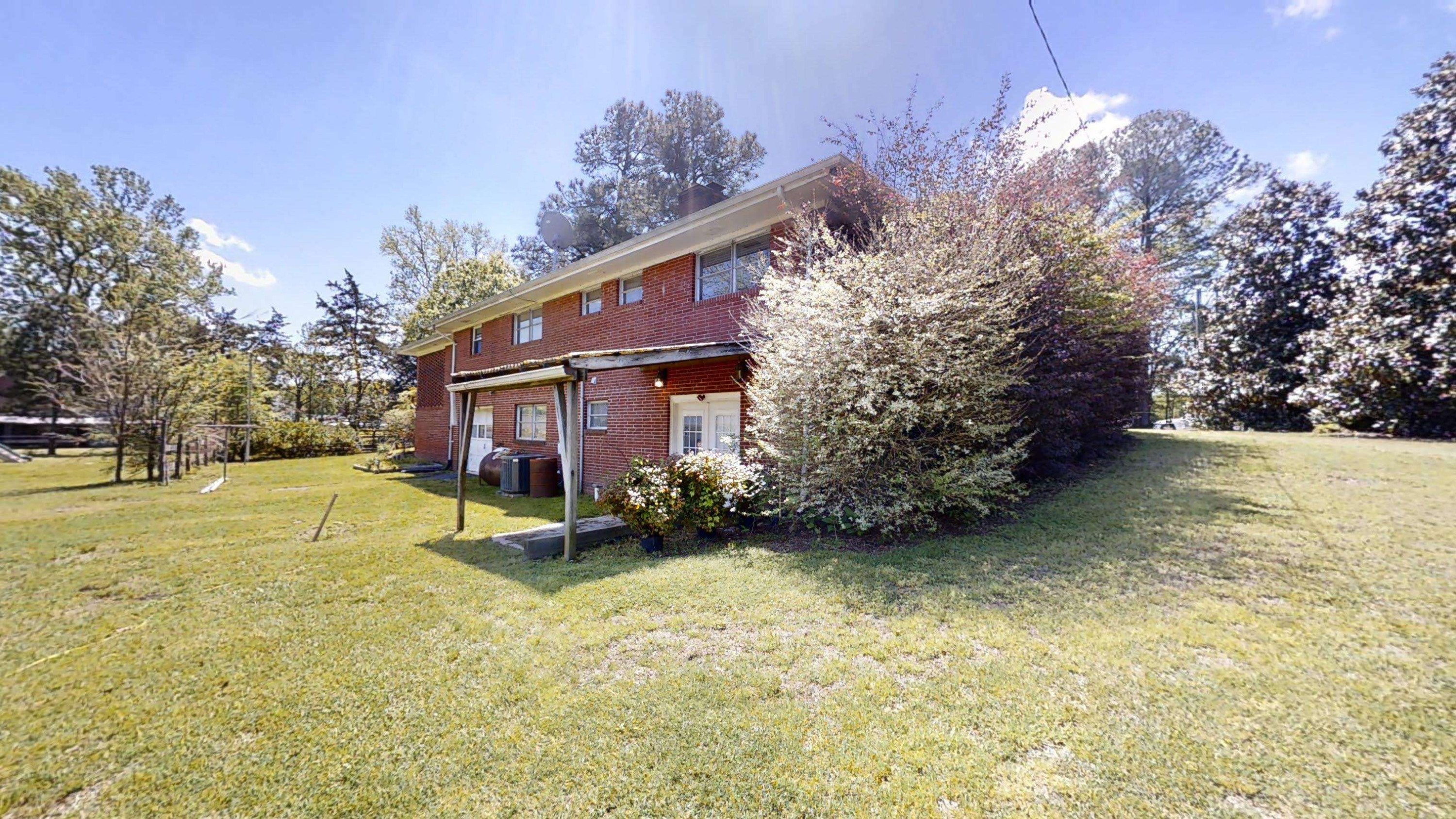 1115 Perry Road Zebulon, NC 27597 - Photo 30 of 37 a view of a house with a yard and tree s