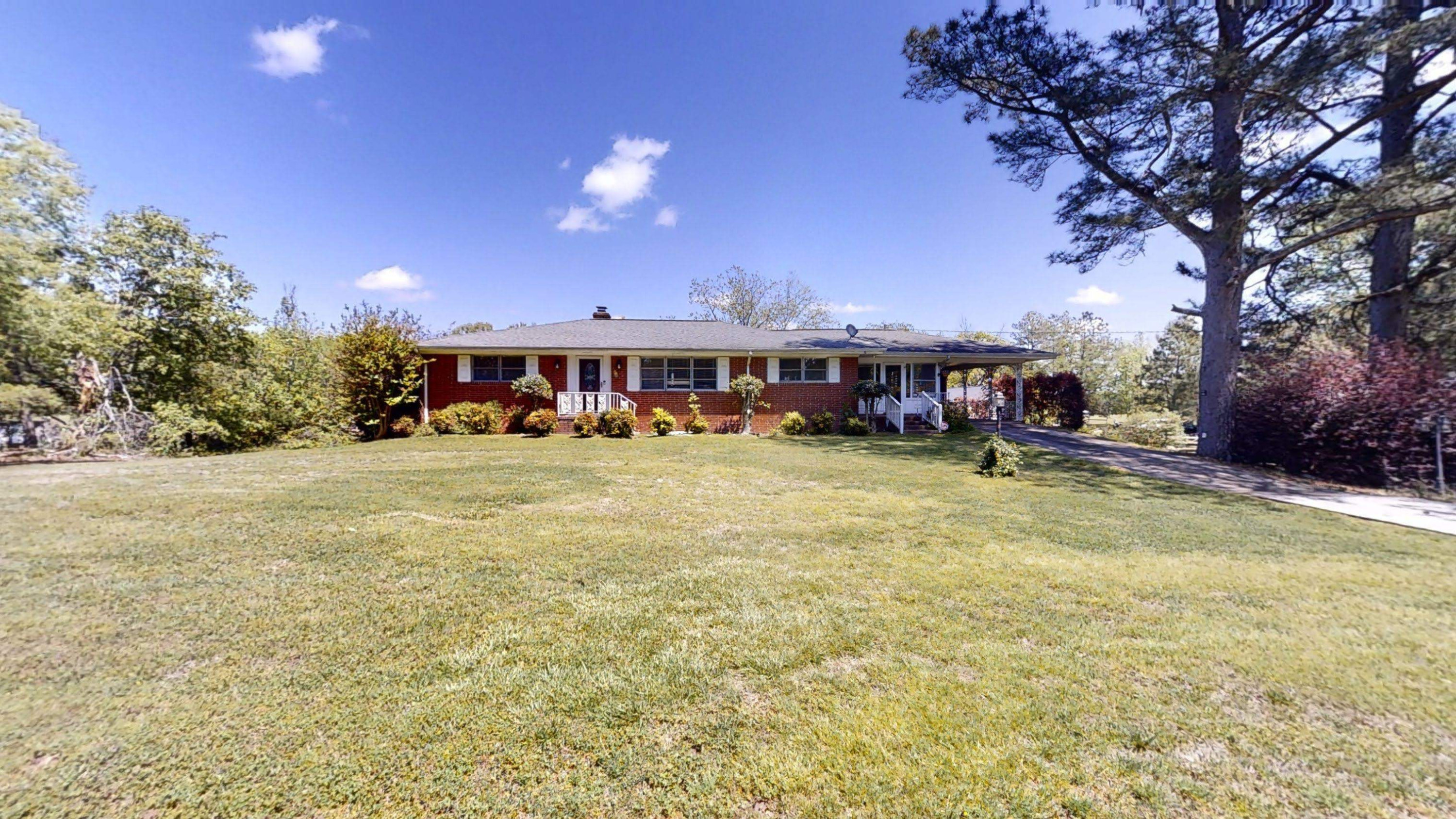 1115 Perry Road Zebulon, NC 27597 - Photo 37 of 37 a view of a house with a yard