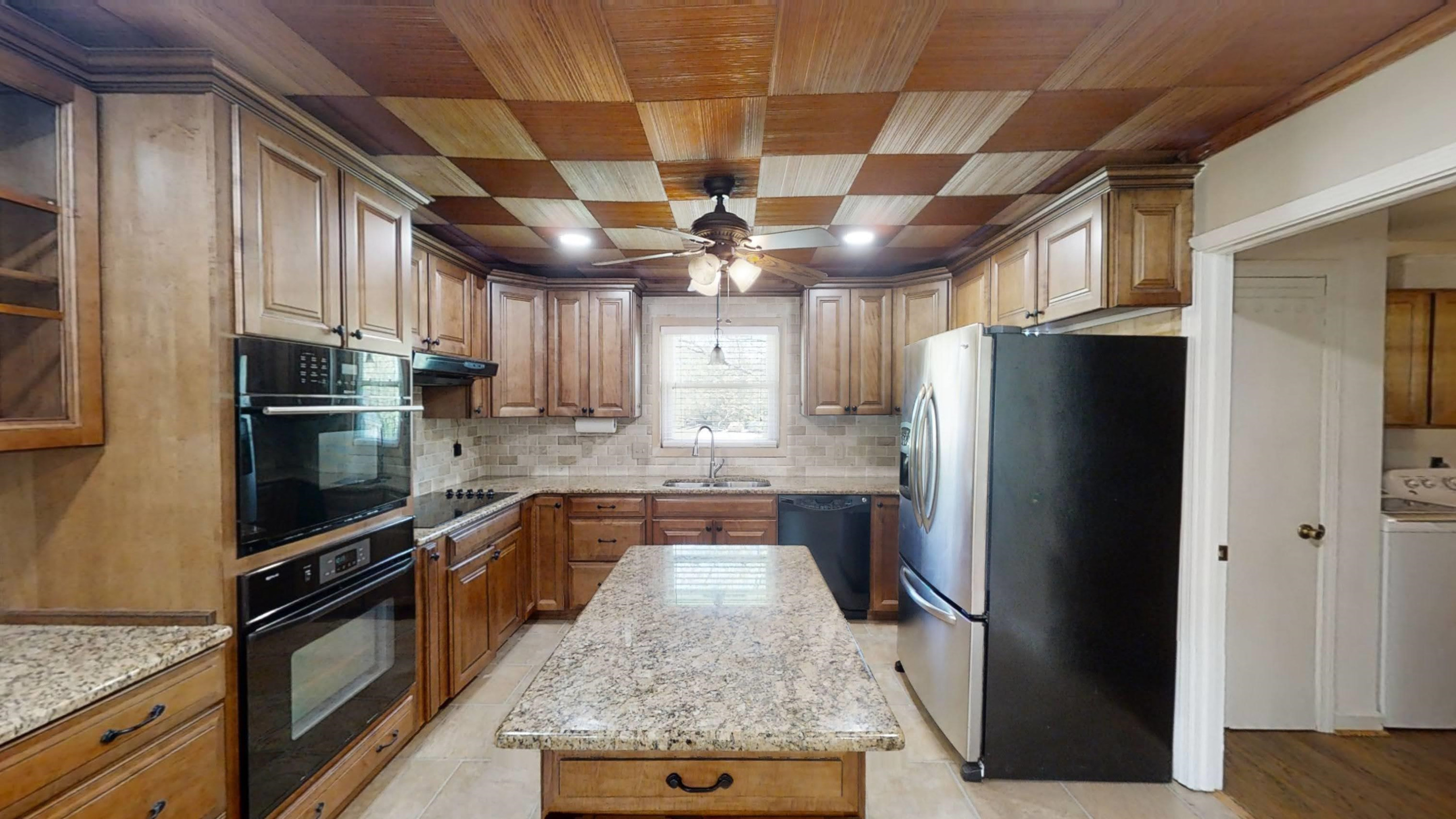 1115 Perry Road Zebulon, NC 27597 - Photo 5 of 37 a kitchen with stainless steel appliances granite countertop a refrigerator a stove and a sink