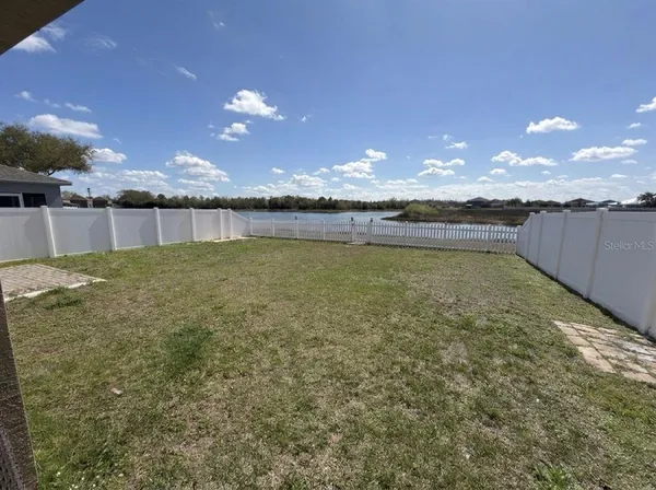 a view of a swimming pool and an outdoor space