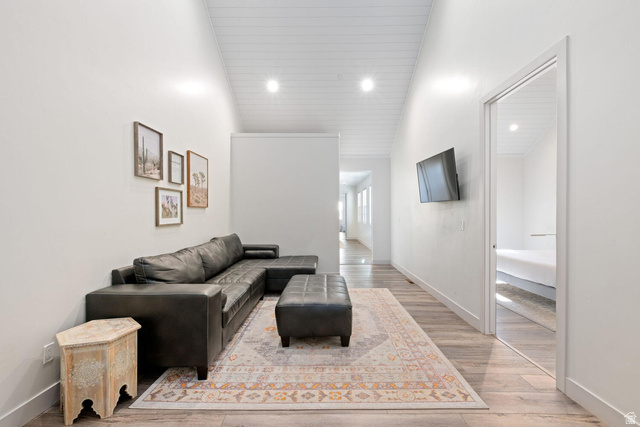 4281 Canterbury Road Hurricane, UT 84737 - Photo 12 of 24 Spacious area featuring wood-finish flooring, white walls, and a vaulted ceiling with recessed lighting
