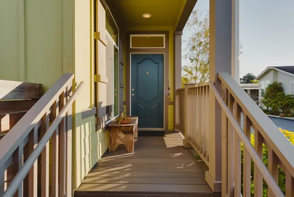 a view of an entryway with wooden floor and stairs