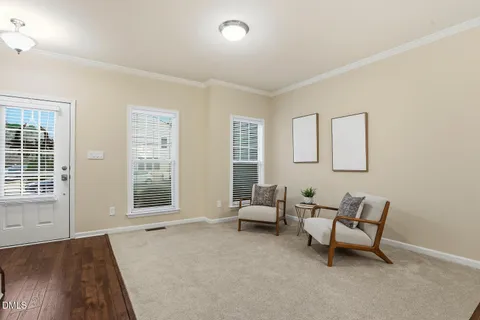 a living room with furniture and windows