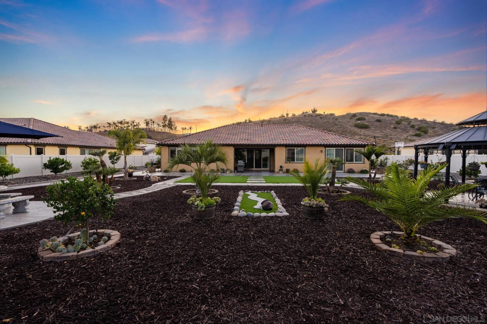 5662 Rancho Del Caballo Bonsall, CA 92003 - Photo 35 of 60 a view of a house with backyard space and garden