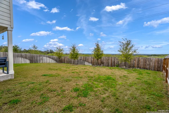 a view of a yard with a house