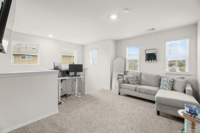 a living room with furniture and a window