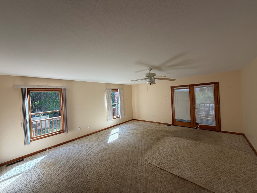 78 Timber Ridge Lane Hayesville, NC 28904 - Photo 12 of 43 an empty room with windows and cabinet
