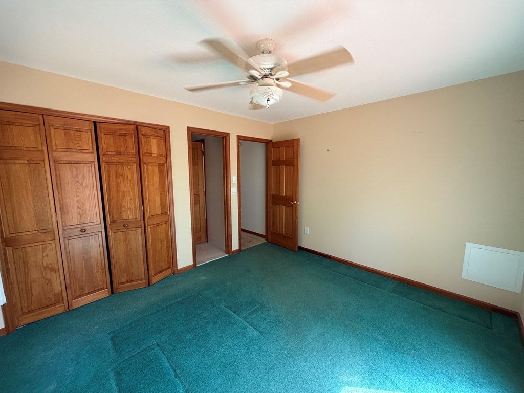 78 Timber Ridge Lane Hayesville, NC 28904 - Photo 18 of 43 a view of an empty room with a ceiling fan