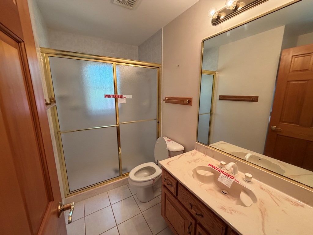 78 Timber Ridge Lane Hayesville, NC 28904 - Photo 20 of 43 a bathroom with a sink toilet and shower