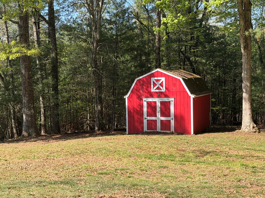 78 Timber Ridge Lane Hayesville, NC 28904 - Photo 41 of 43 a large tree with a wooden fence