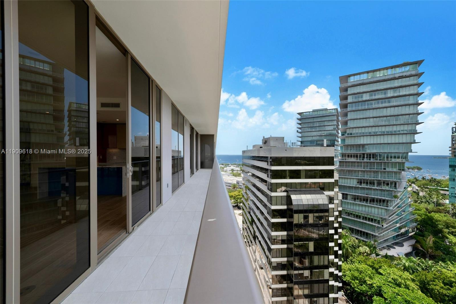 2678 Tigertail Avenue, Unit 1501 Miami, FL 33133 - Photo 17 of 44 a city view with tall buildings