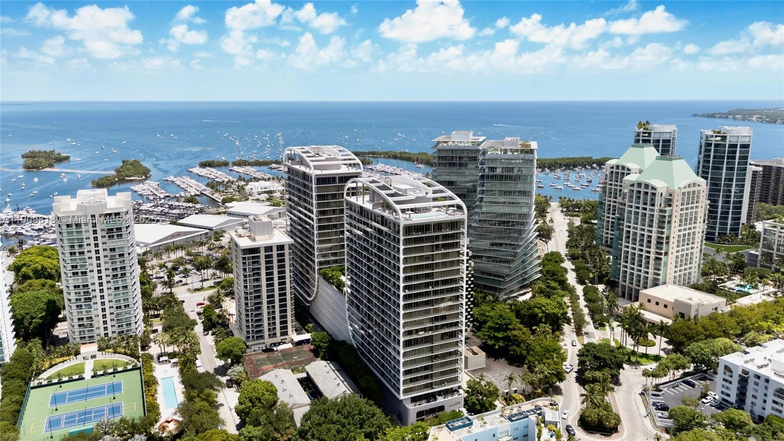 2678 Tigertail Avenue, Unit 1501 Miami, FL 33133 - Photo 22 of 44 a view of buildings with yard