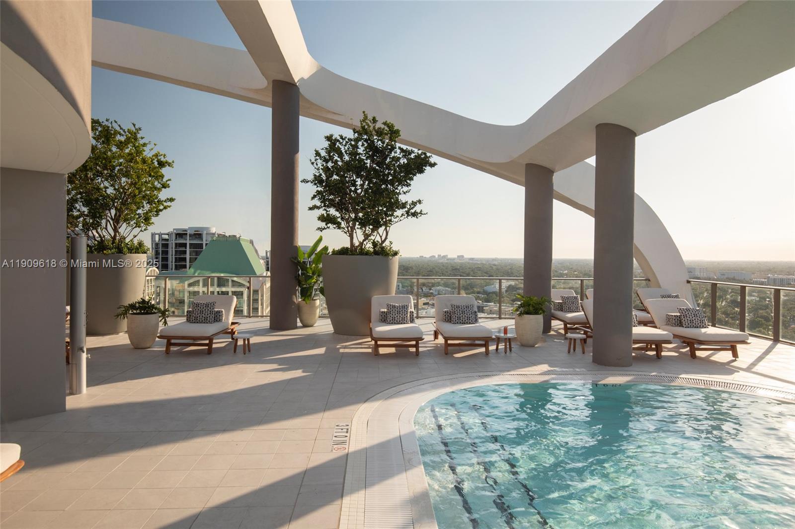 2678 Tigertail Avenue, Unit 1501 Miami, FL 33133 - Photo 26 of 44 a building with view of tall trees