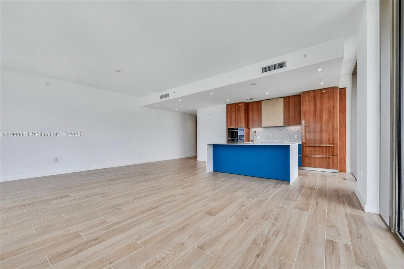 2678 Tigertail Avenue, Unit 1501 Miami, FL 33133 - Photo 3 of 44 a view of kitchen with wooden floor