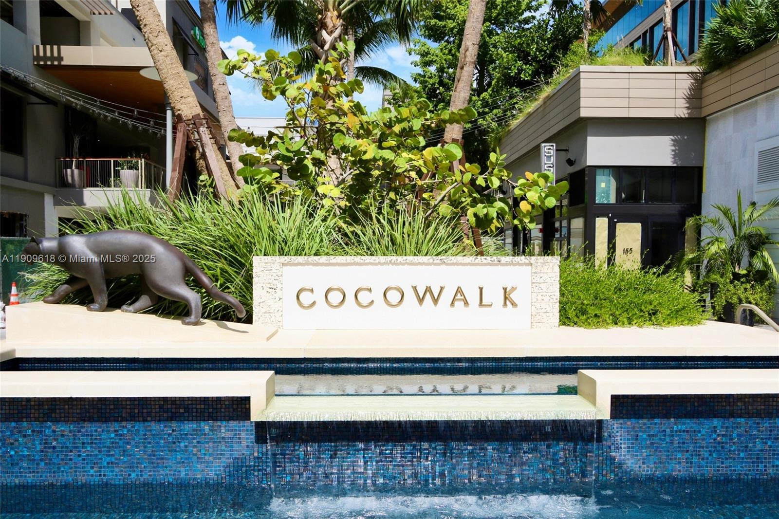 2678 Tigertail Avenue, Unit 1501 Miami, FL 33133 - Photo 41 of 44 a view of outdoor space with signage and flags