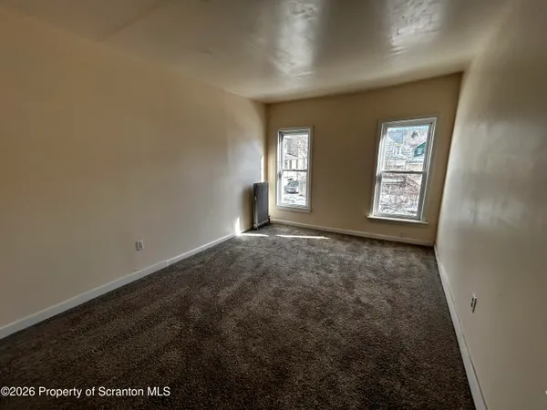 an empty room with windows