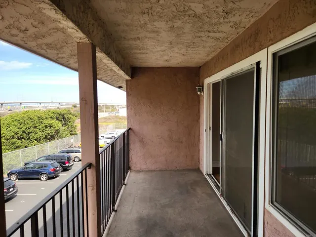 a view of a porch with wooden floor and stairs