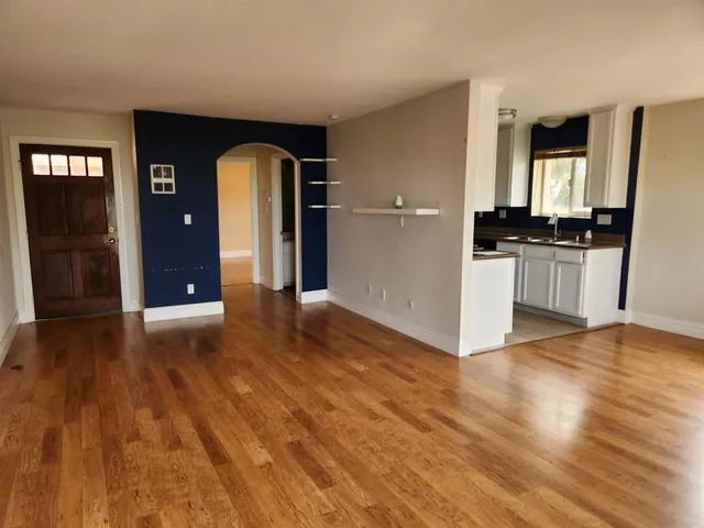 a view of a kitchen with a sink and a stove