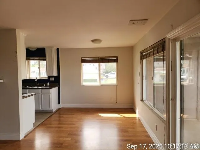 a view of a kitchen cabinets and wooden floor