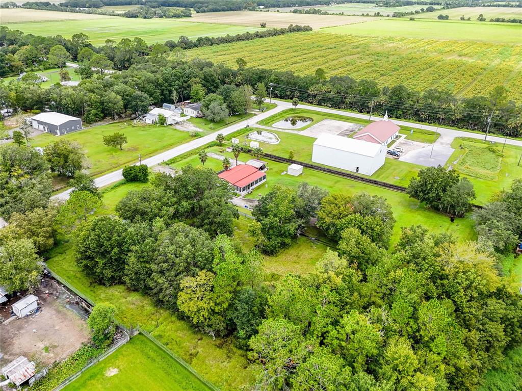 1089 Aspen Street Bunnell, FL 32110 - Photo 4 of 15 a view of yard with swimming pool and outdoor seating