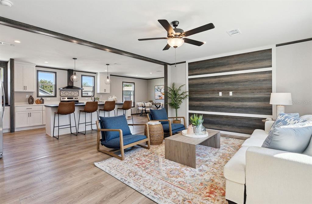 1089 Aspen Street Bunnell, FL 32110 - Photo 6 of 15 a living room with furniture and wooden floor