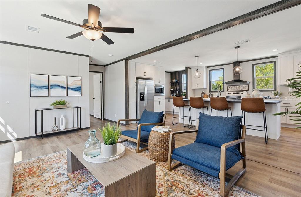 1089 Aspen Street Bunnell, FL 32110 - Photo 7 of 15 a living room with furniture and a wooden floor