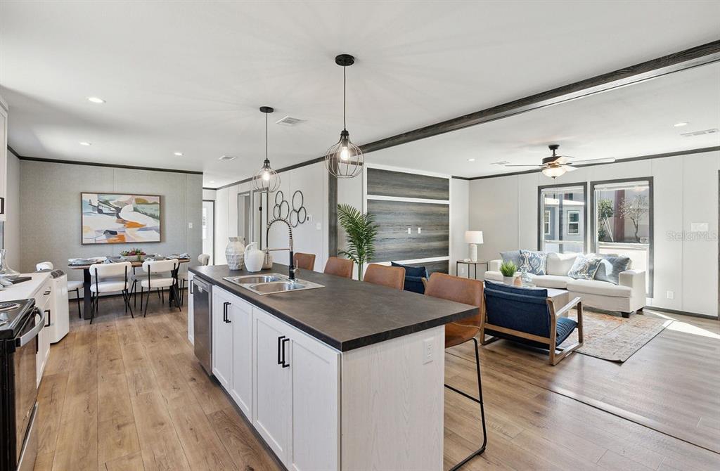 1089 Aspen Street Bunnell, FL 32110 - Photo 10 of 15 a open kitchen with stainless steel appliances granite countertop a stove and cabinets