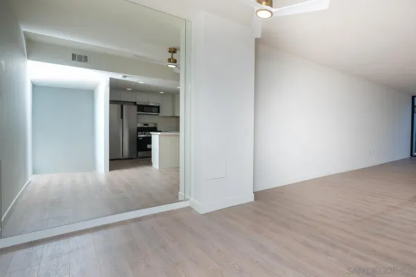 a kitchen with a sink and steel appliances