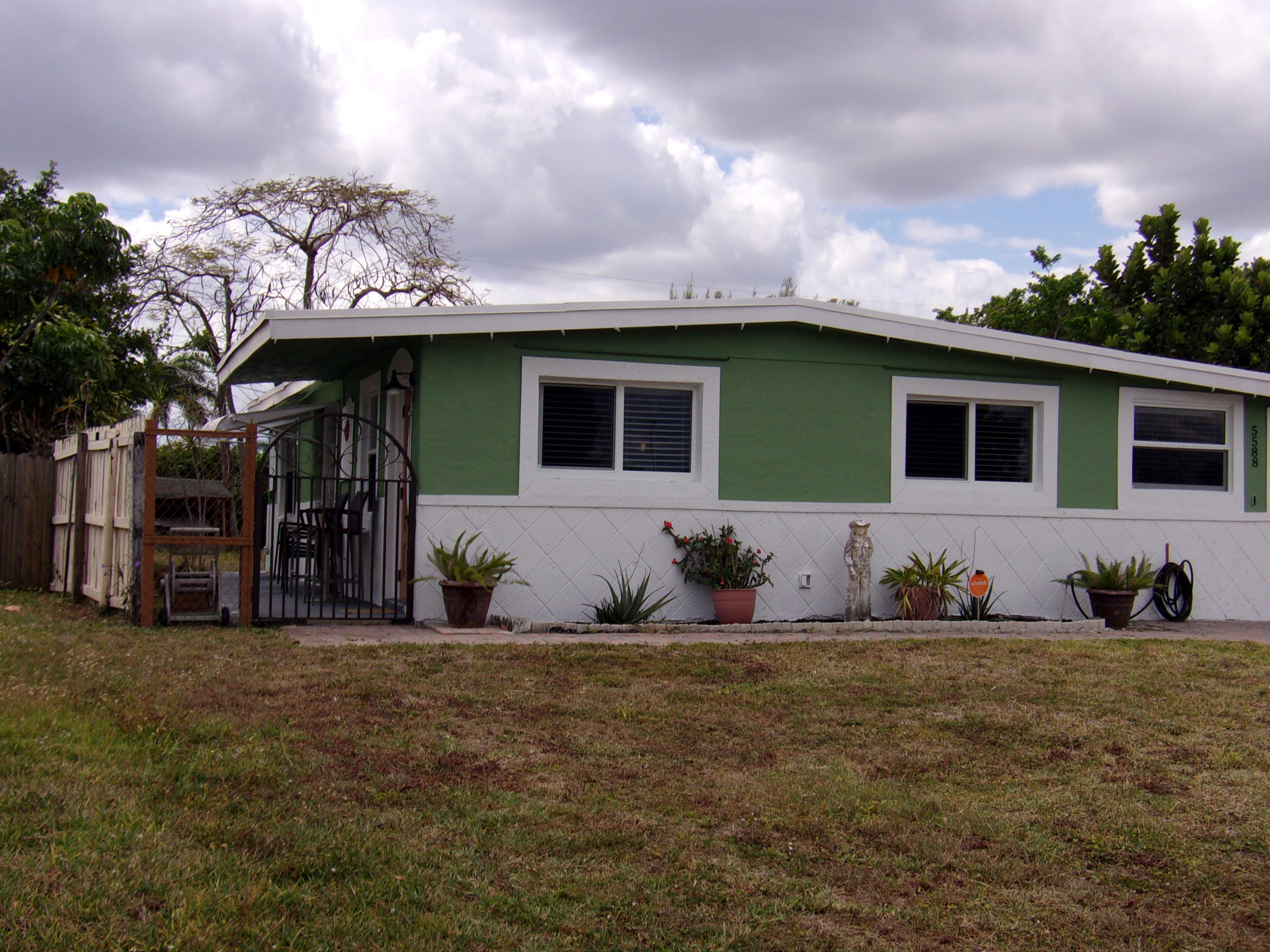 5588 South Rue Road West Palm Beach, FL 33415 - Photo 29 of 29 a front view of a house with yard