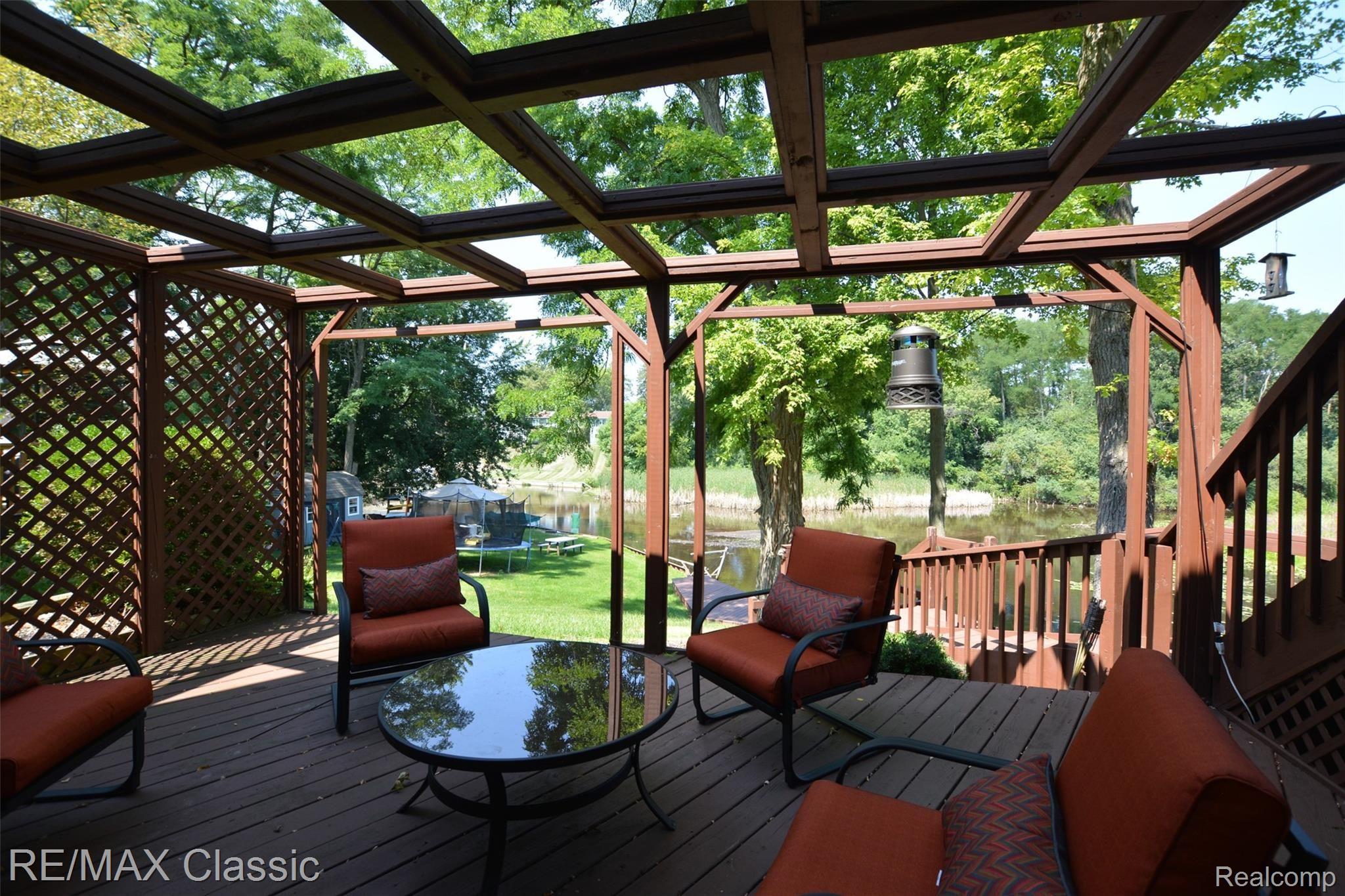 892 Brighton Lake Road Brighton, MI 48116 - Photo 32 of 39 Lower Deck w/Pergola