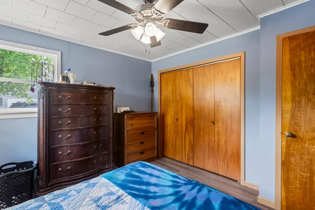 a bedroom with a bed and a dresser