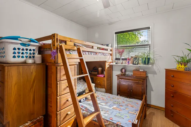 a bed room with furniture and a window