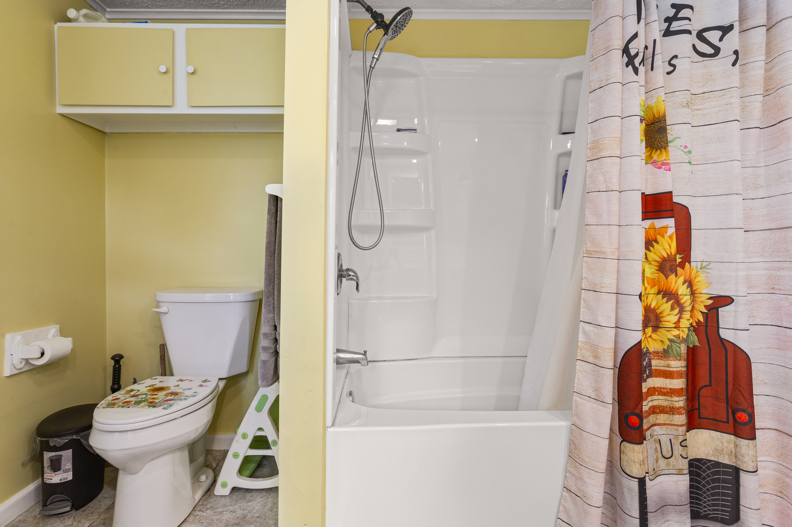 13 Willow Street Dewey, IL 61840 - Photo 24 of 27 a bathroom with a toilet and shower