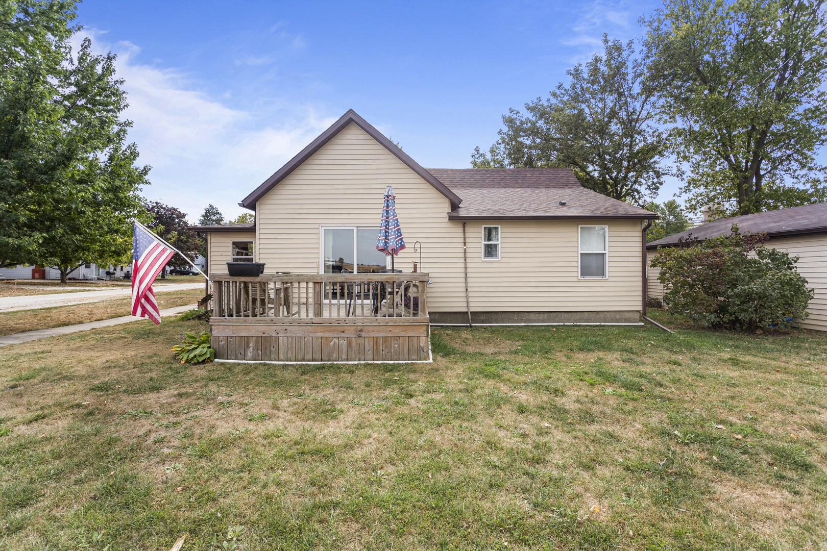 13 Willow Street Dewey, IL 61840 - Photo 4 of 27 a view of a house with a yard and sitting area