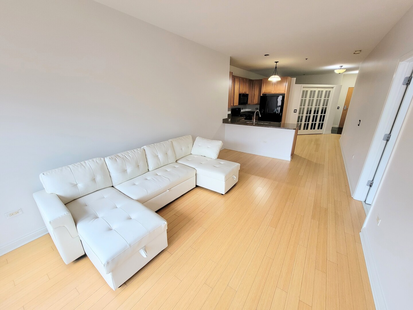 8 West Monroe Street, Unit 1508 Chicago, IL 60603 - Photo 11 of 25 a living room with furniture and kitchen view