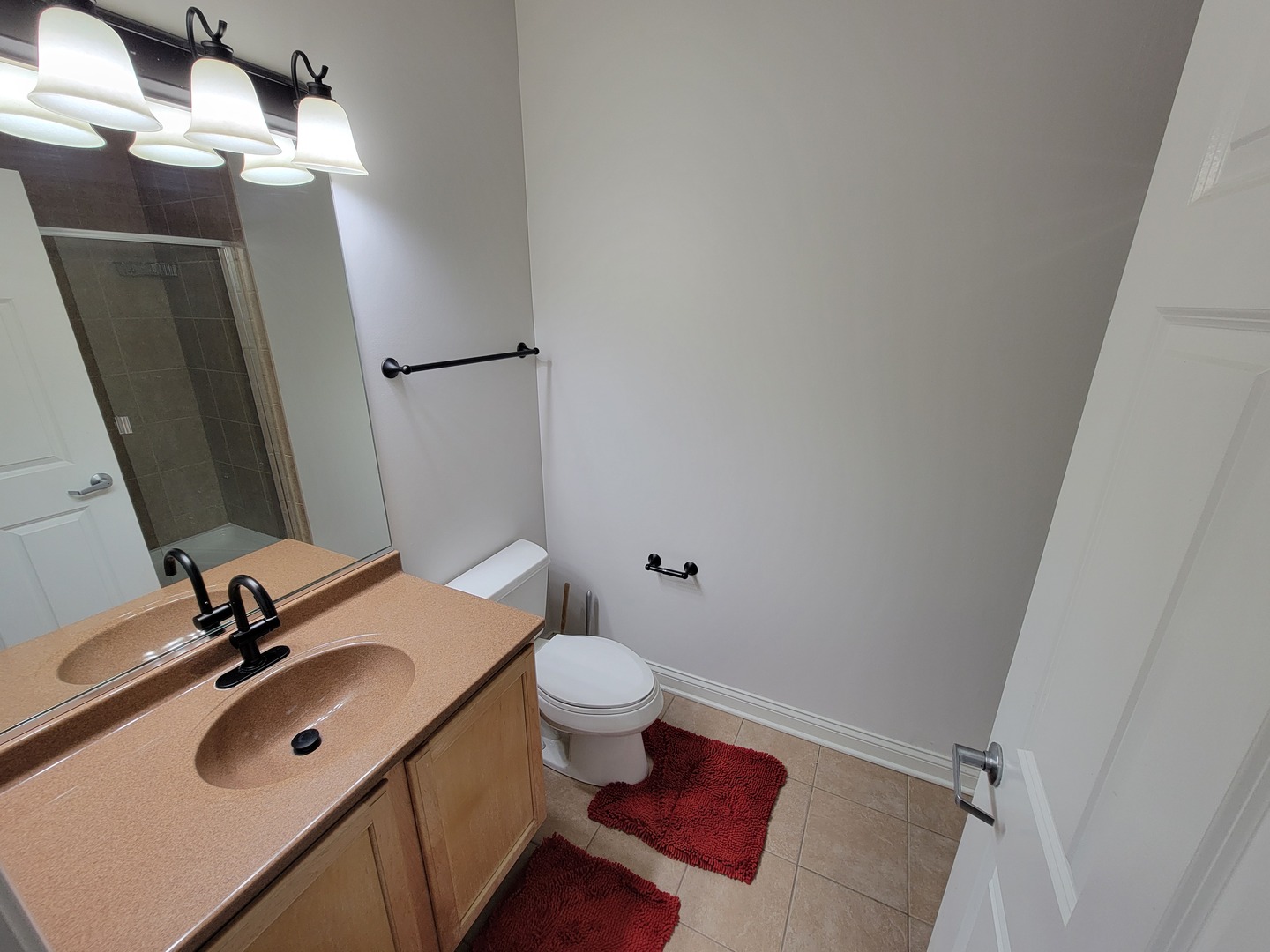 8 West Monroe Street, Unit 1508 Chicago, IL 60603 - Photo 13 of 25 a bathroom with a sink vanity mirror and toilet
