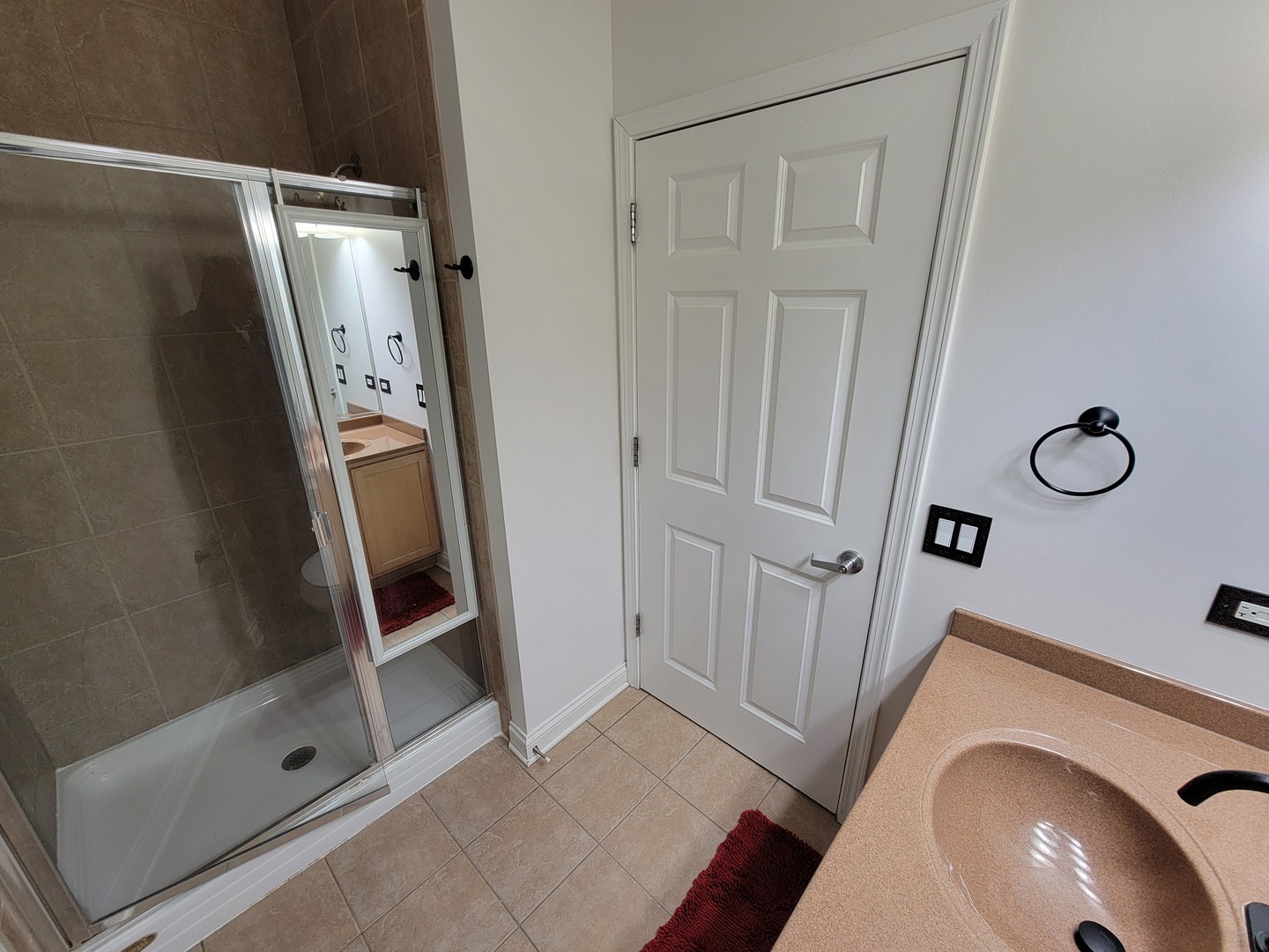 8 West Monroe Street, Unit 1508 Chicago, IL 60603 - Photo 14 of 25 a bathroom with a glass door shower and a sink