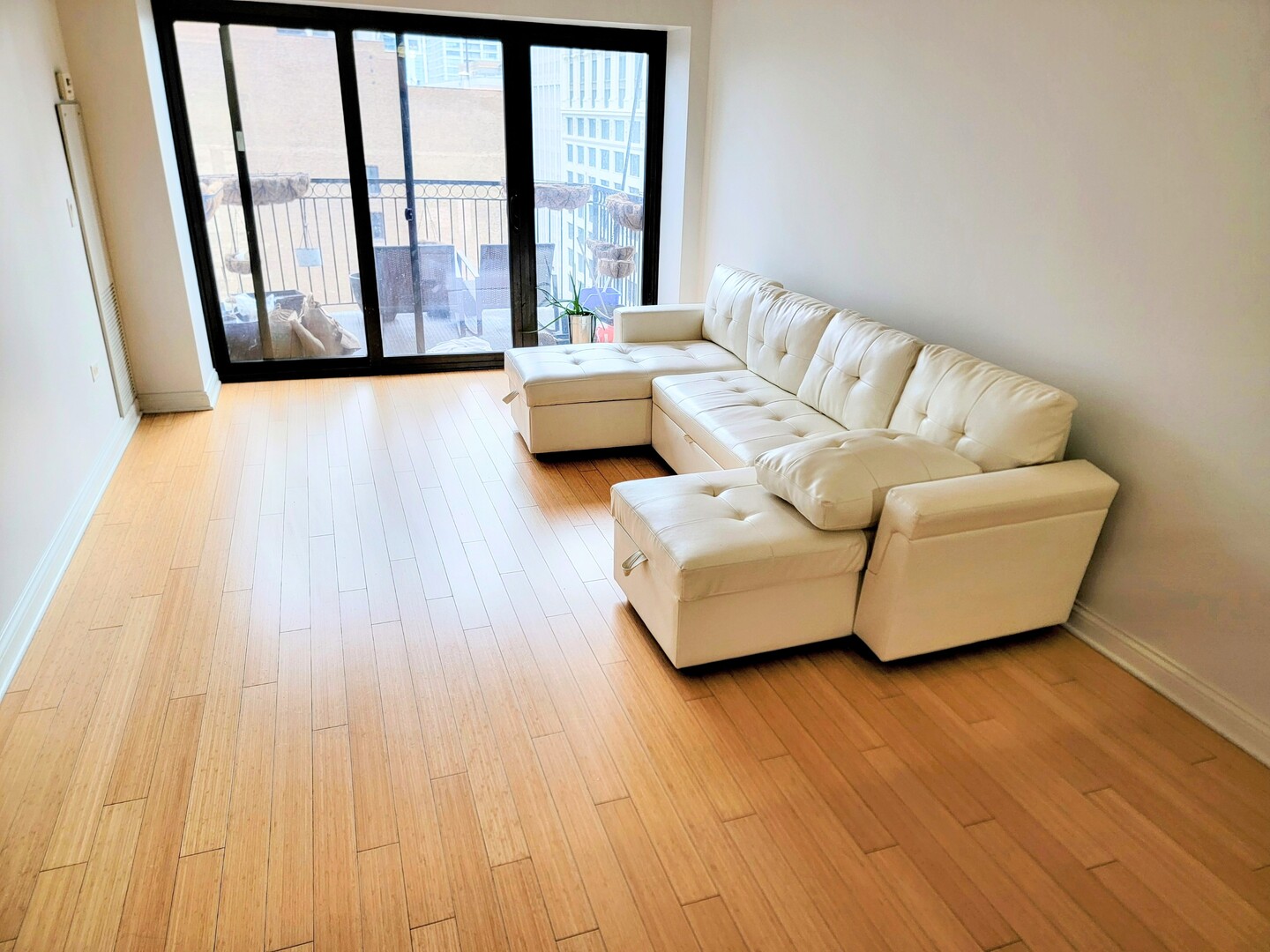 8 West Monroe Street, Unit 1508 Chicago, IL 60603 - Photo 2 of 25 a living room with furniture and a large window