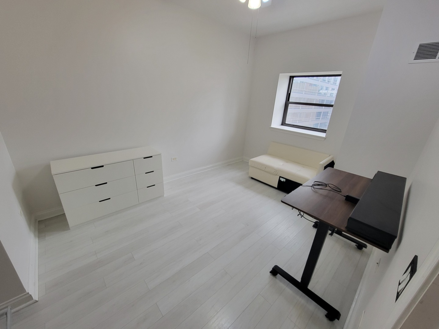 8 West Monroe Street, Unit 1508 Chicago, IL 60603 - Photo 3 of 25 a living room with furniture and a air conditioner vent
