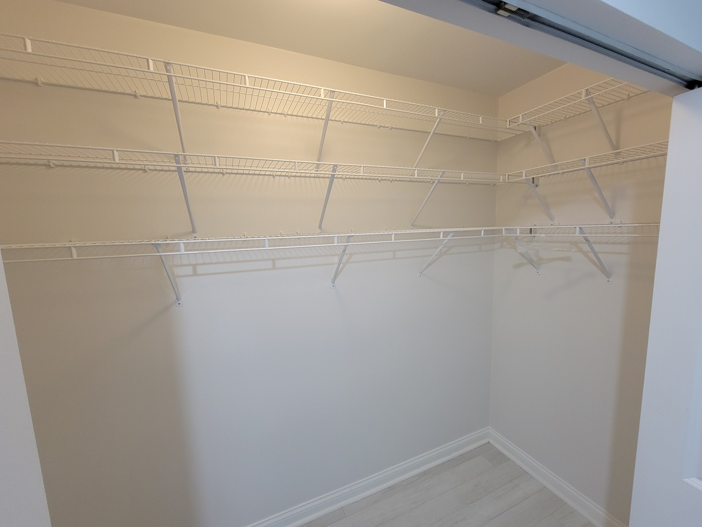 8 West Monroe Street, Unit 1508 Chicago, IL 60603 - Photo 5 of 25 a view of a room with racks on the wall