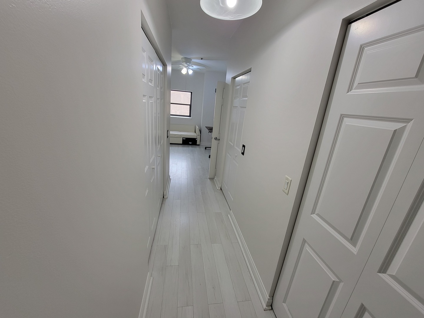8 West Monroe Street, Unit 1508 Chicago, IL 60603 - Photo 9 of 25 a view of a room with wooden floor and staircase