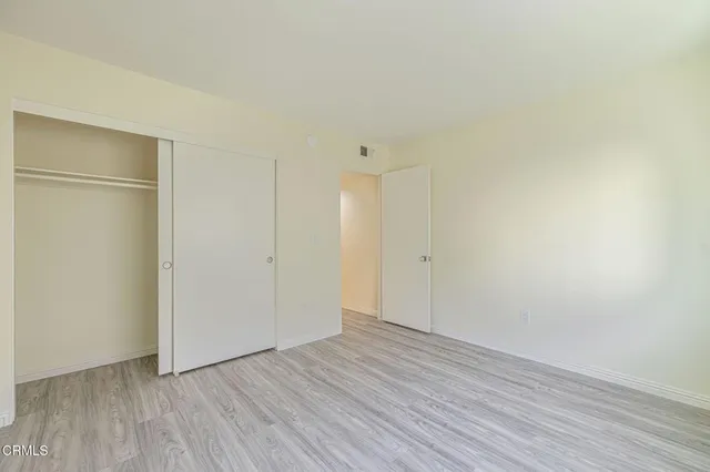 a view of a house with a door and a yard