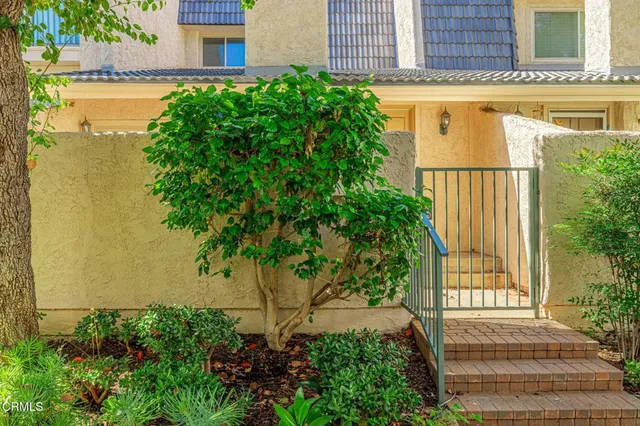 front view of a house with a garden