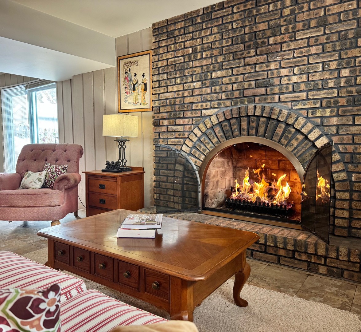 416 Trinity Court Buffalo Grove, IL 60089 - Photo 4 of 87 a living room with furniture and a fireplace