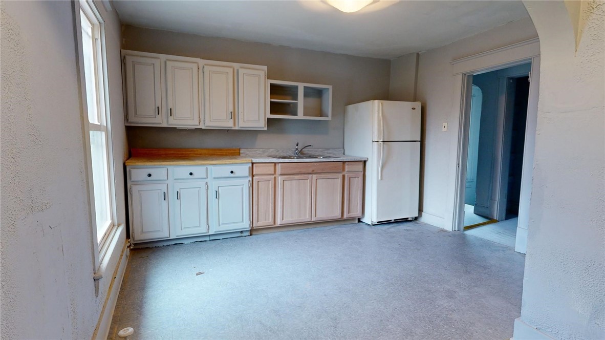 501 South Crea Street Decatur, IL 62522 - Photo 8 of 34 a kitchen with white cabinets