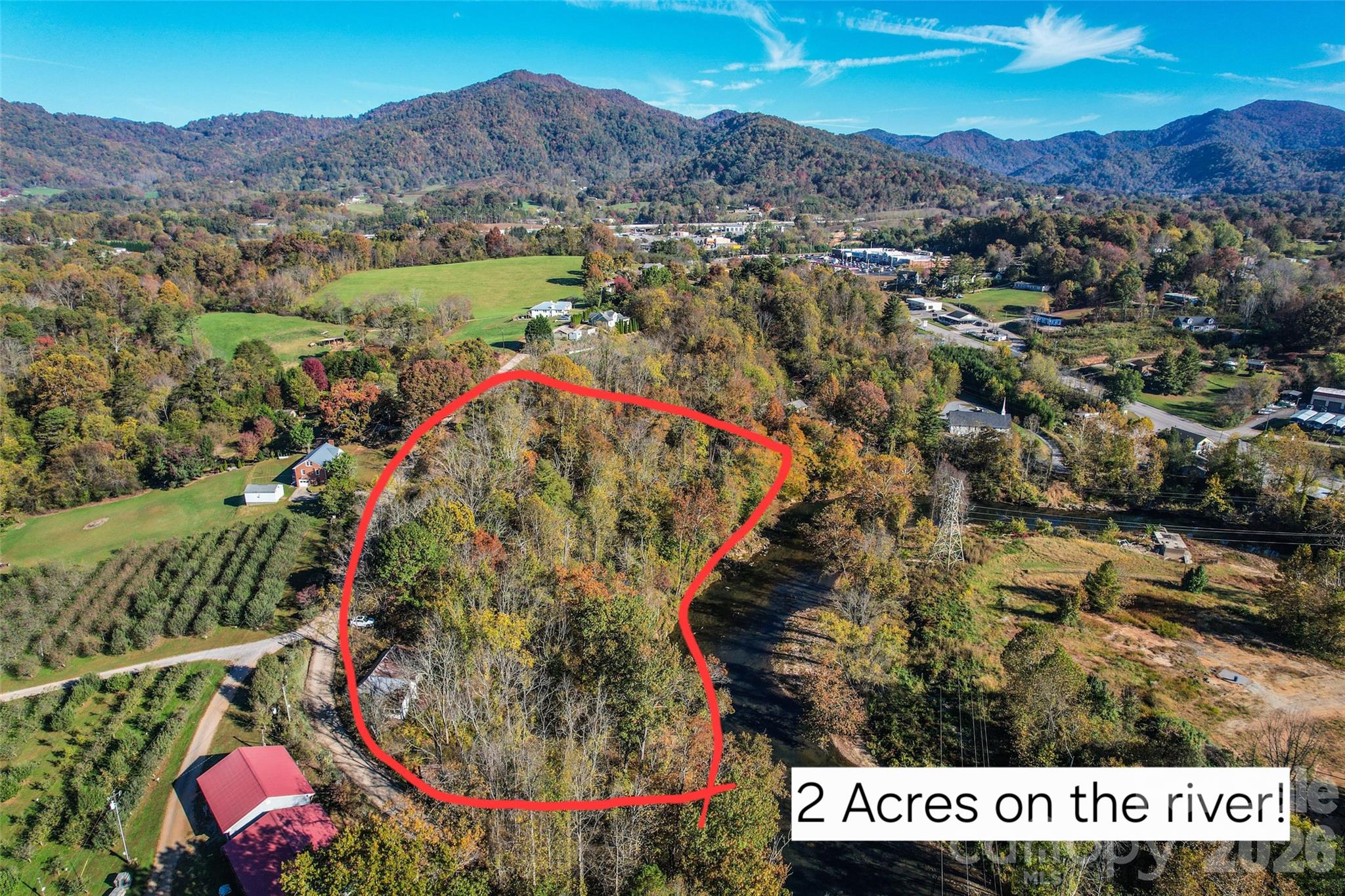 415 Pigeon Ford Road Canton, NC 28716 - Photo 4 of 5 an aerial view of a house a garden and mountain view