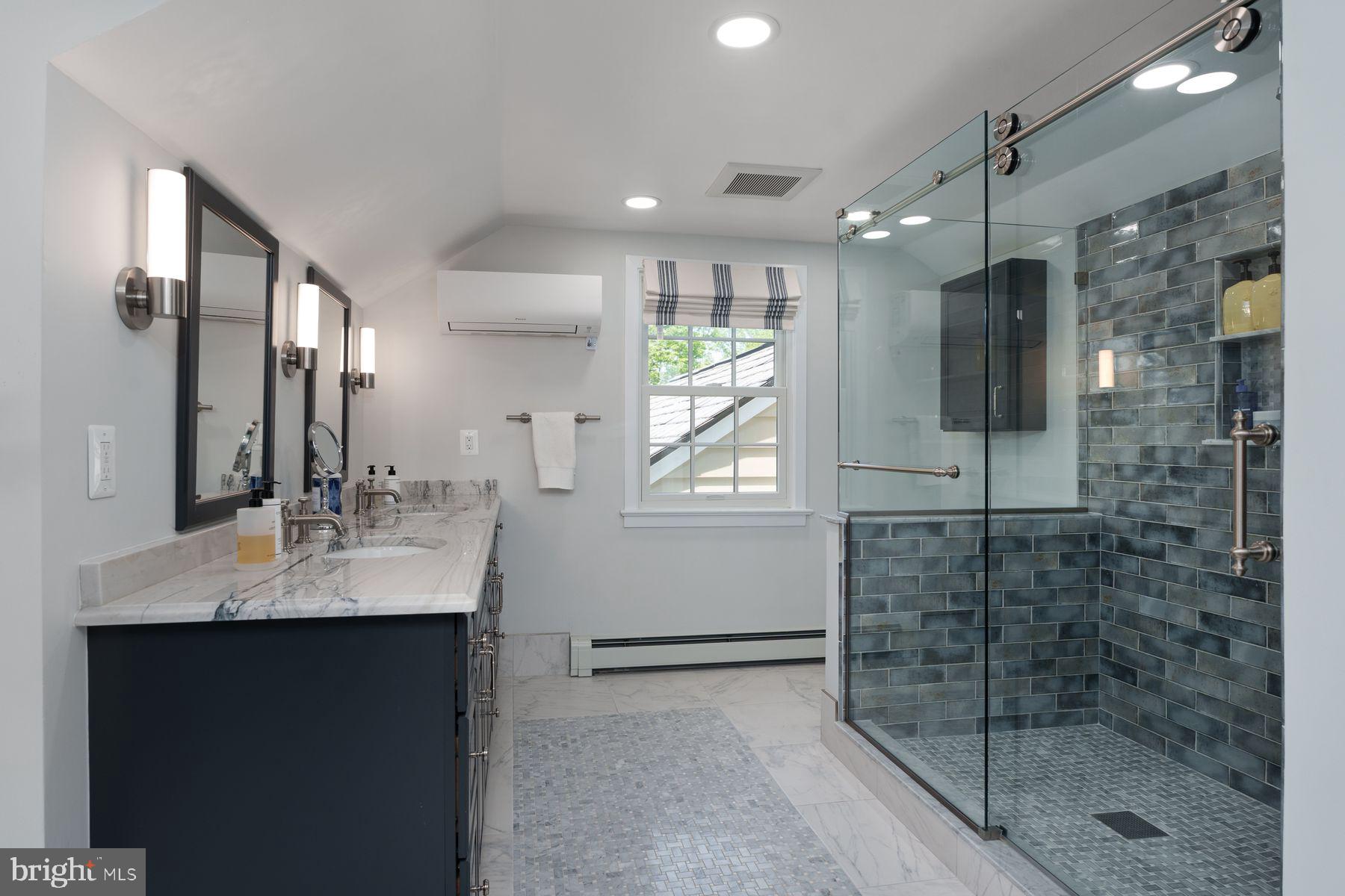 821 Pretty Brook Road Princeton, NJ 08540 - Photo 24 of 32 a bathroom with a sink shower and a mirror