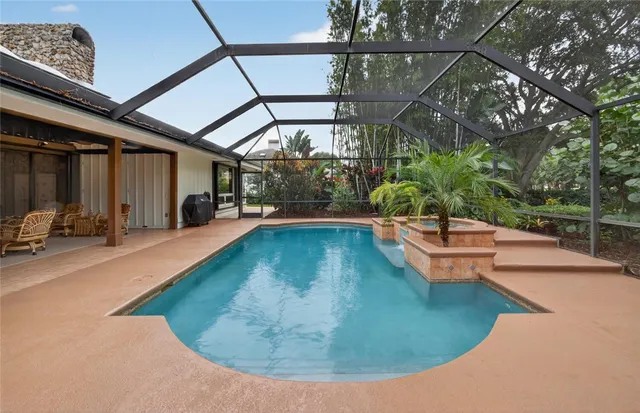 a view of a swimming pool with a patio