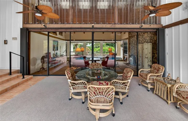 a dining area with furniture and outdoor view
