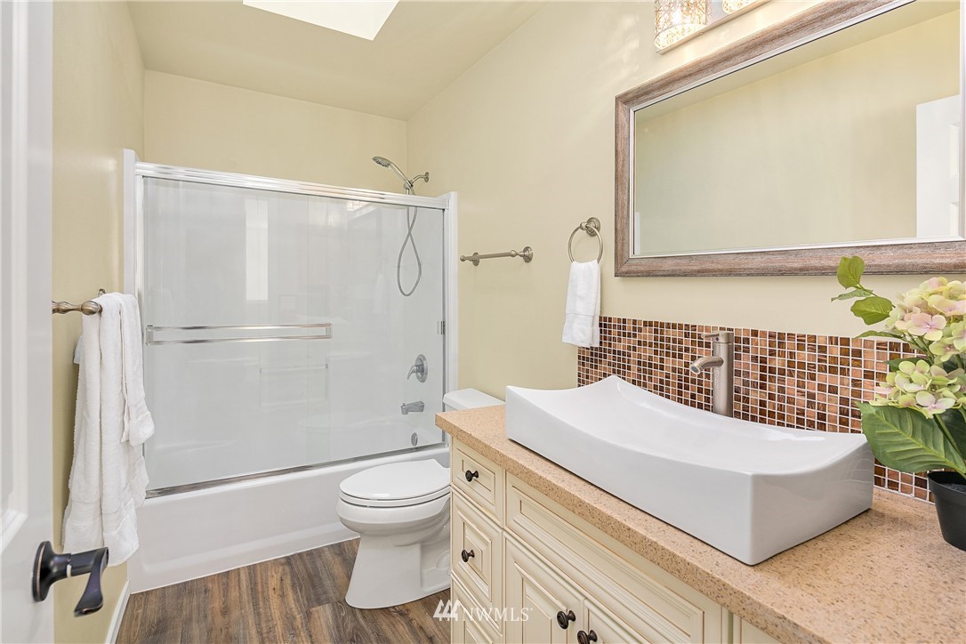 4700 Northeast 23rd Street Renton, WA 98059 - Photo 22 of 28 a bathroom with a sink toilet and shower